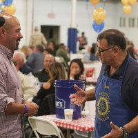 Rotarian Jesus Garcia greets Lemoore Mayor Ray Madrigal.